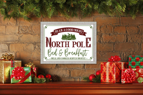 North Pole Bed and Breakfast 15" x 21.5" Framed Christmas Wall Decor Art Print Sign Poster in a White Wooden Frame with UV Acrylic and Hangers