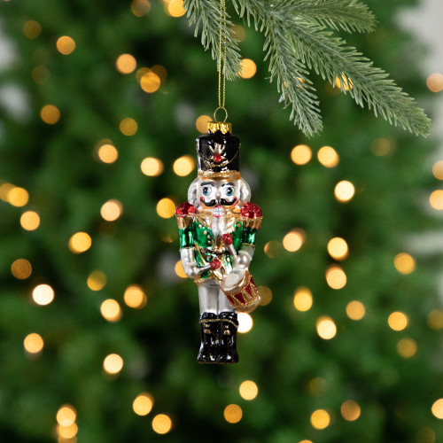 5.25" Green, Red and Gold Nutcracker With Drum Glass Christmas Ornament