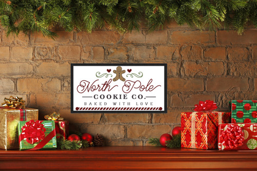 North Pole Cookie Company Gingerbread 11.5" x 21.5" Framed Christmas Wall Decor  Sign Poster in a Black Wooden Frame with UV Acrylic and Hangers
