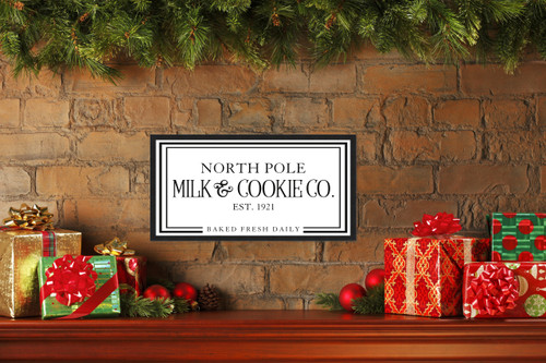 North Pole Milk and Cookie Company 11.5" x 21.5" Framed Christmas Wall Decor  Sign Poster in a Black Wooden Frame with UV Acrylic and Hangers