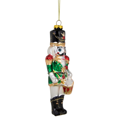 5.25" Green, Red and Gold Nutcracker With Drum Glass Christmas Ornament