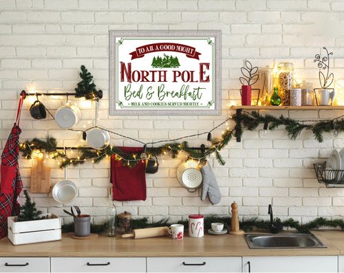 North Pole Bed and Breakfast 15" x 21.5" Framed Christmas Wall Decor Art Print Sign Poster in a White Wooden Frame with UV Acrylic and Hangers