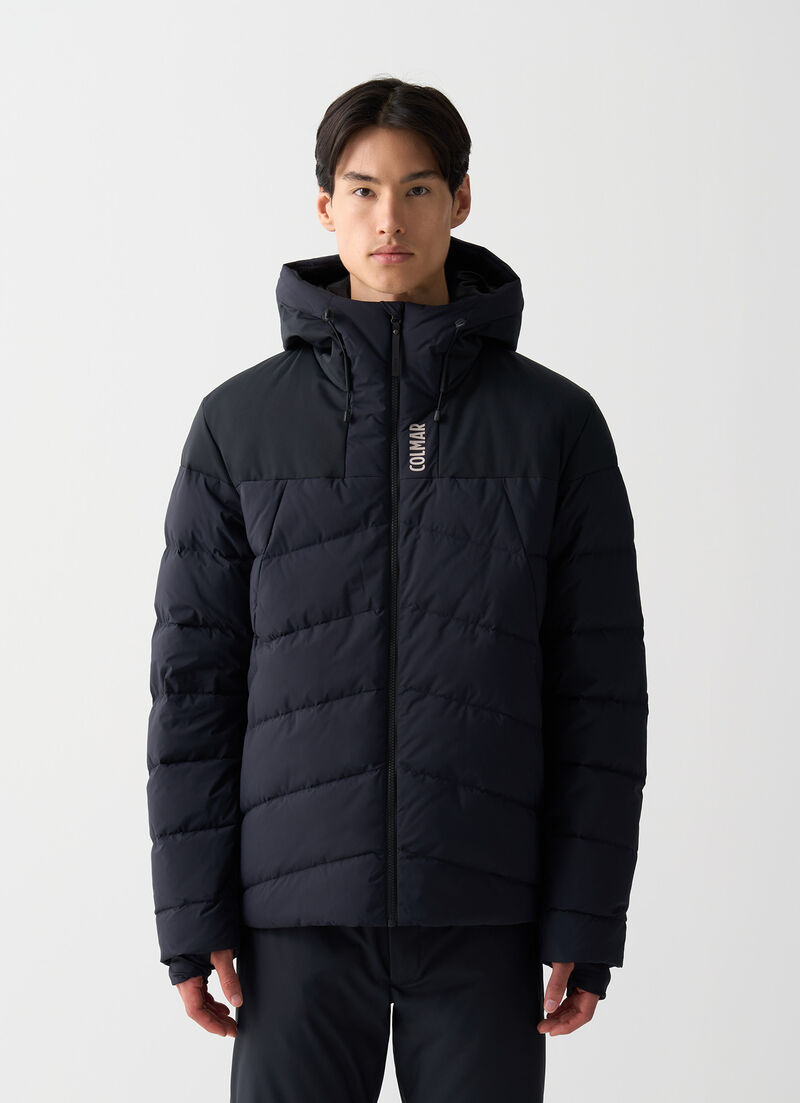 Ski gloves with stretch inserts