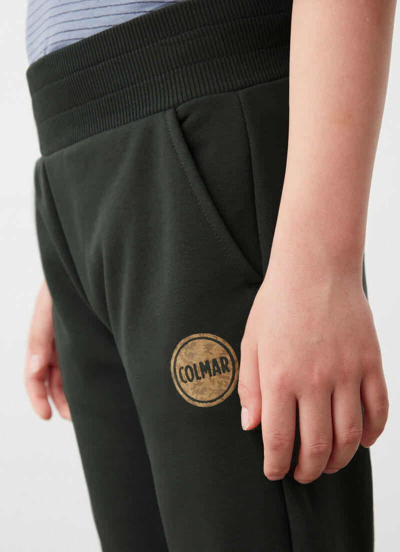 Tracksuit bottoms with camouflage logo