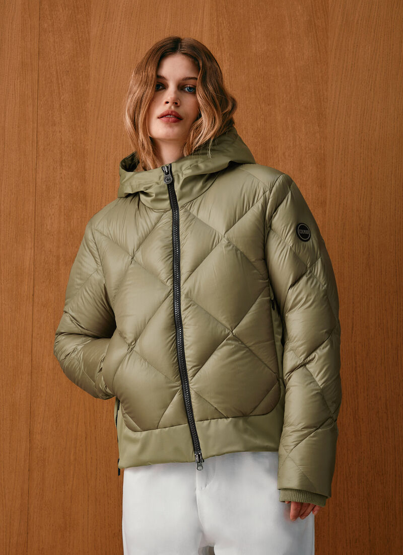 Down jacket with lateral side zip closure.