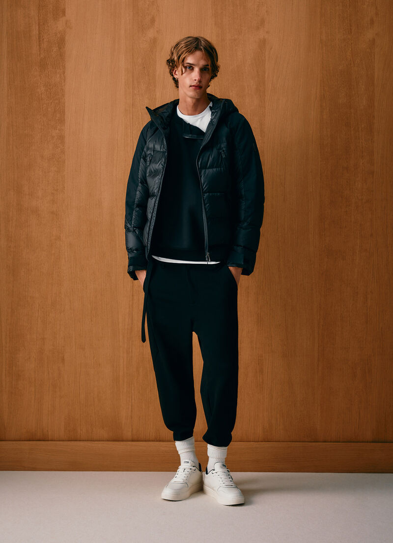 Down jacket with waxed sleeves