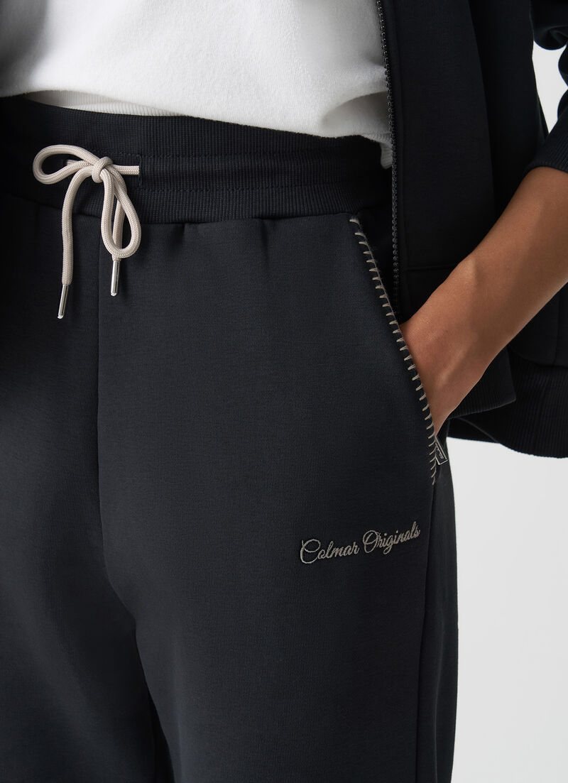 Tracksuit bottoms with embroidery