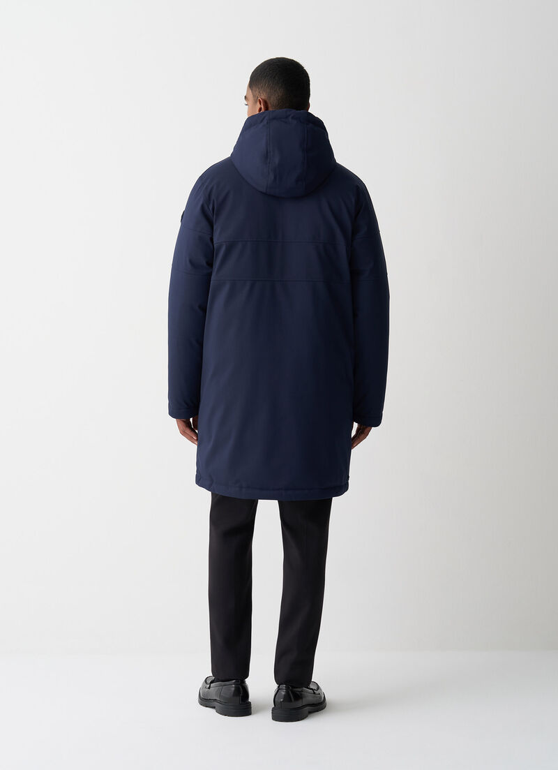 Long twill down jacket with patch pockets.