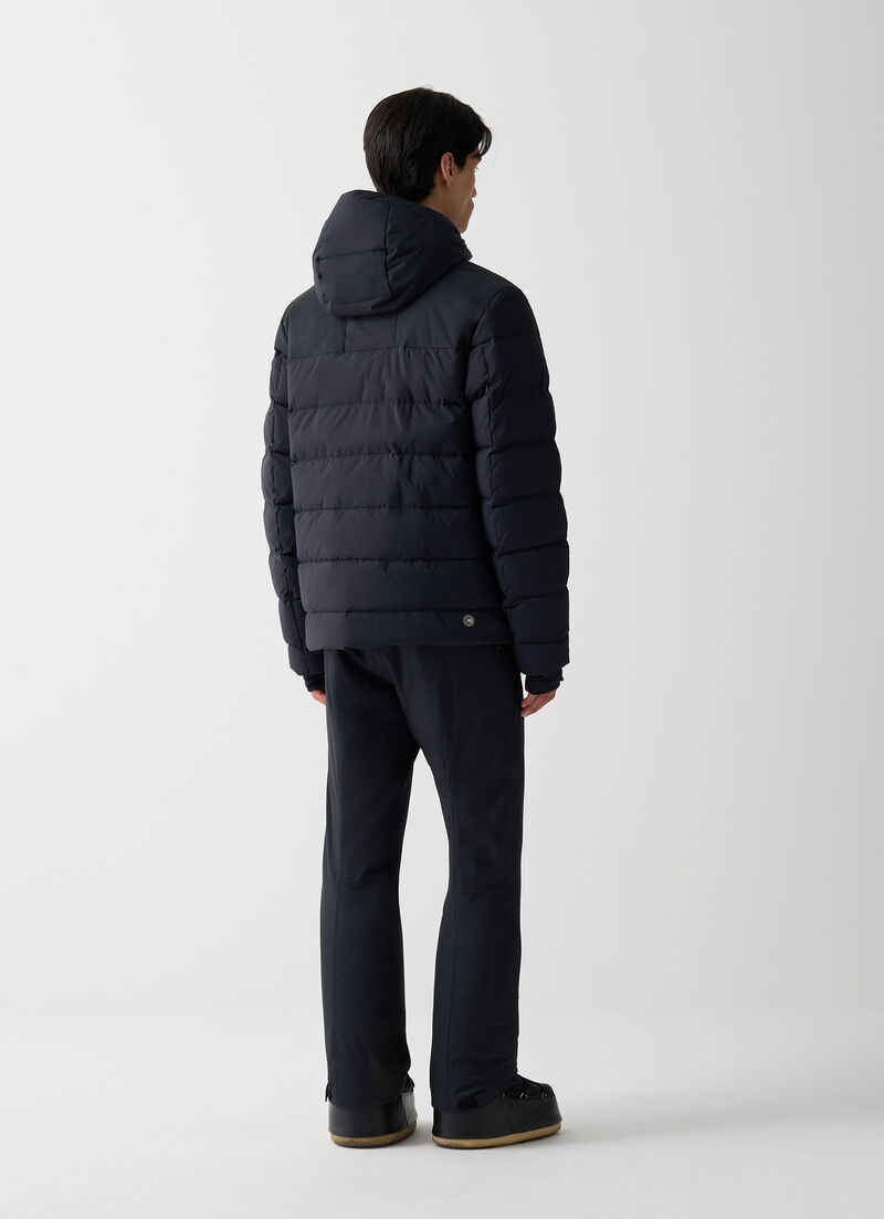 Ski gloves with stretch inserts