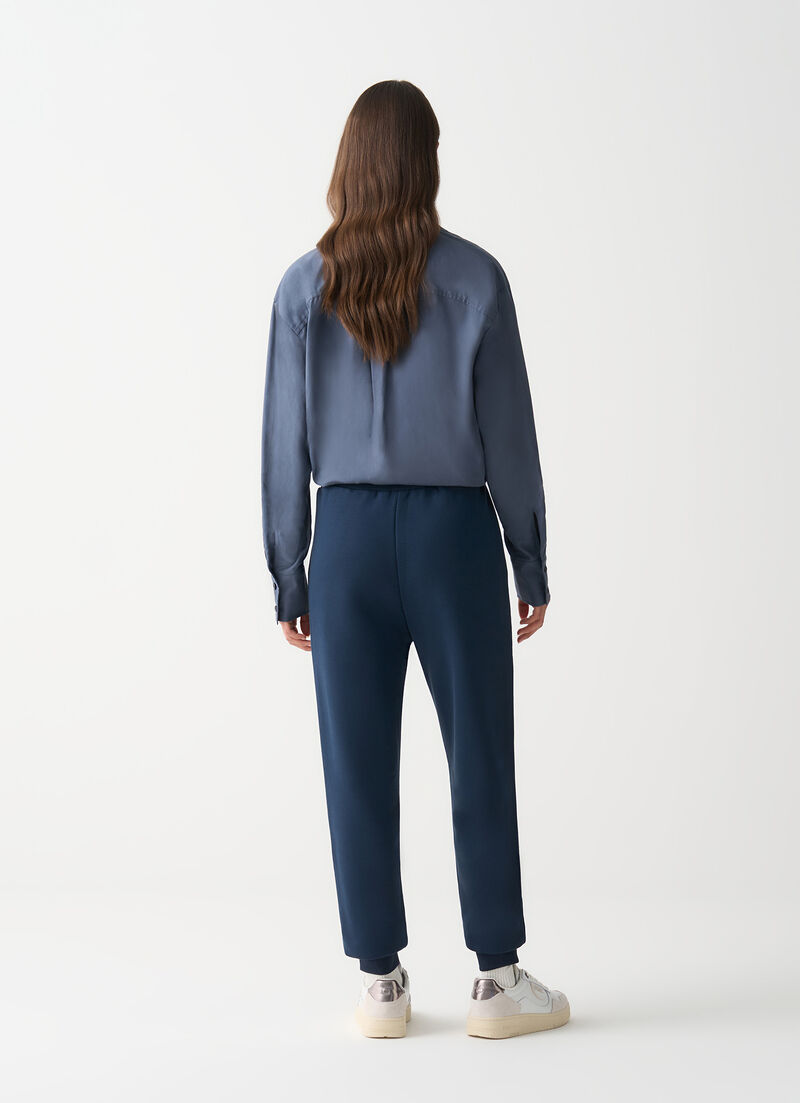 Tracksuit bottoms with embroidery