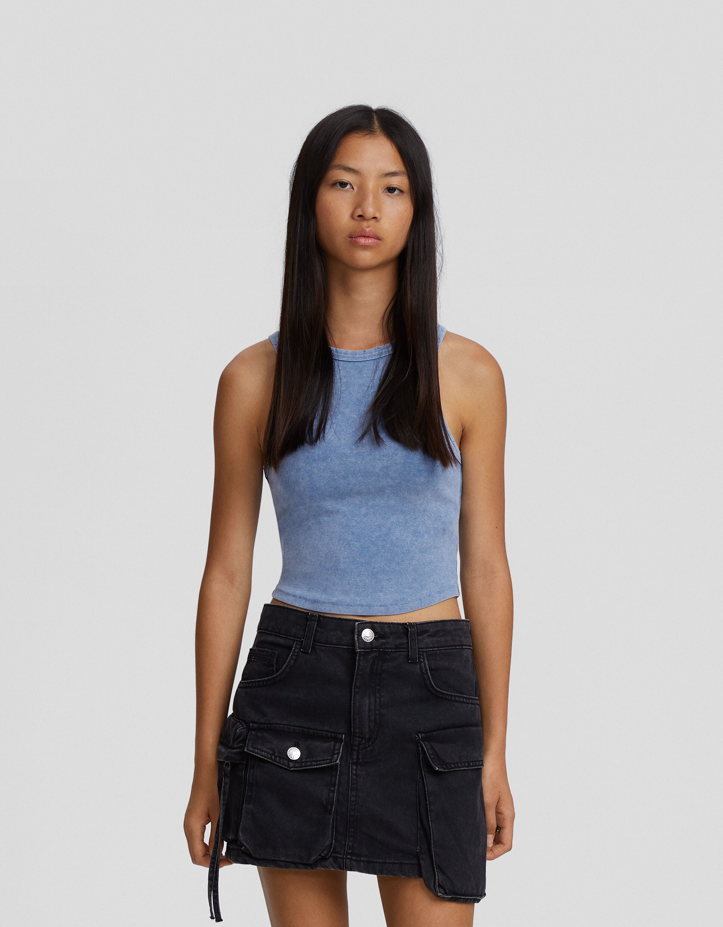 Camiseta sin mangas efecto lavado rotos