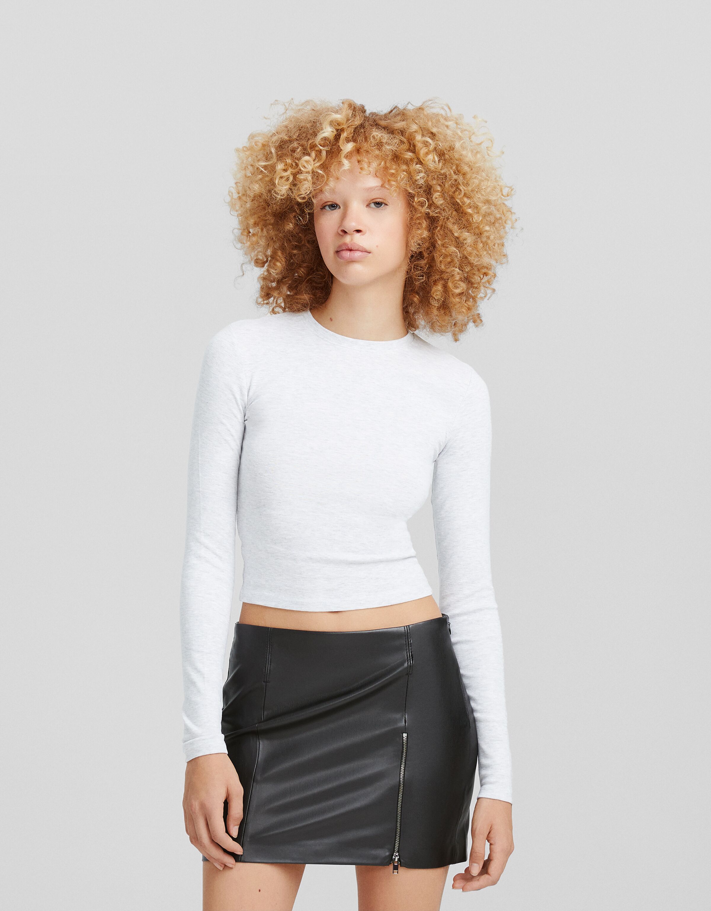 Falda mini cremallera frontal efecto piel