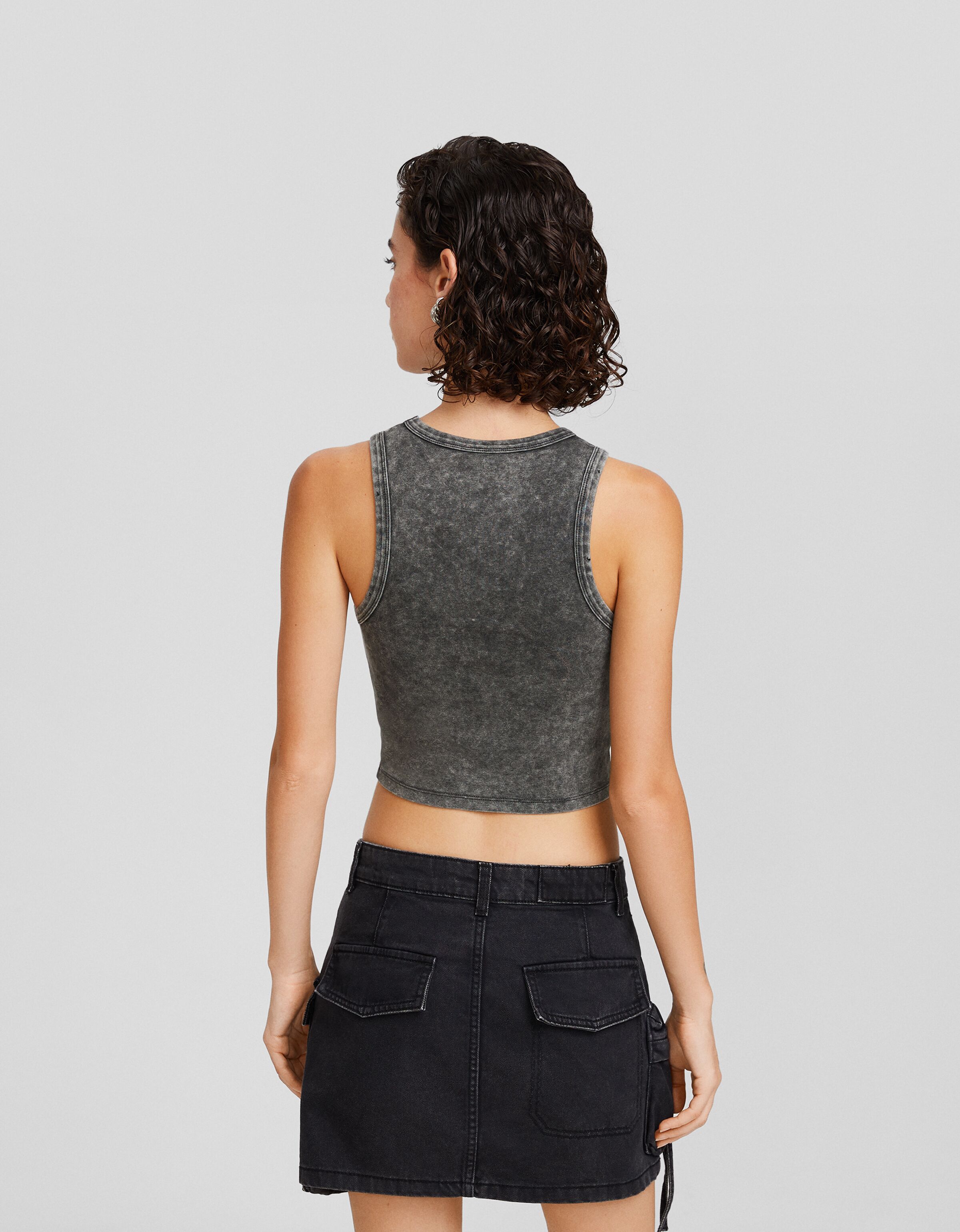 Camiseta sin mangas efecto lavado rotos