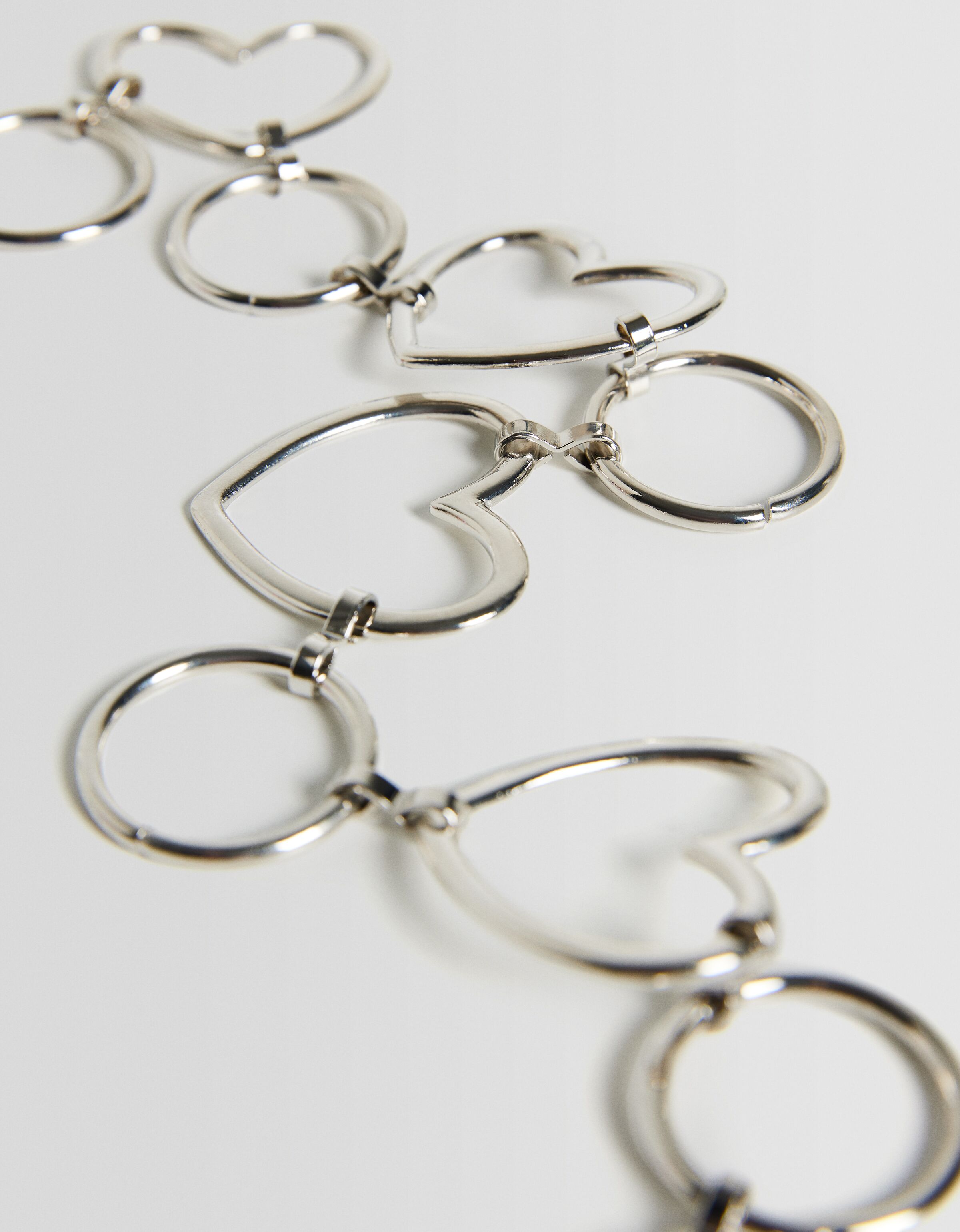 Cinturón cadena corazones anillas