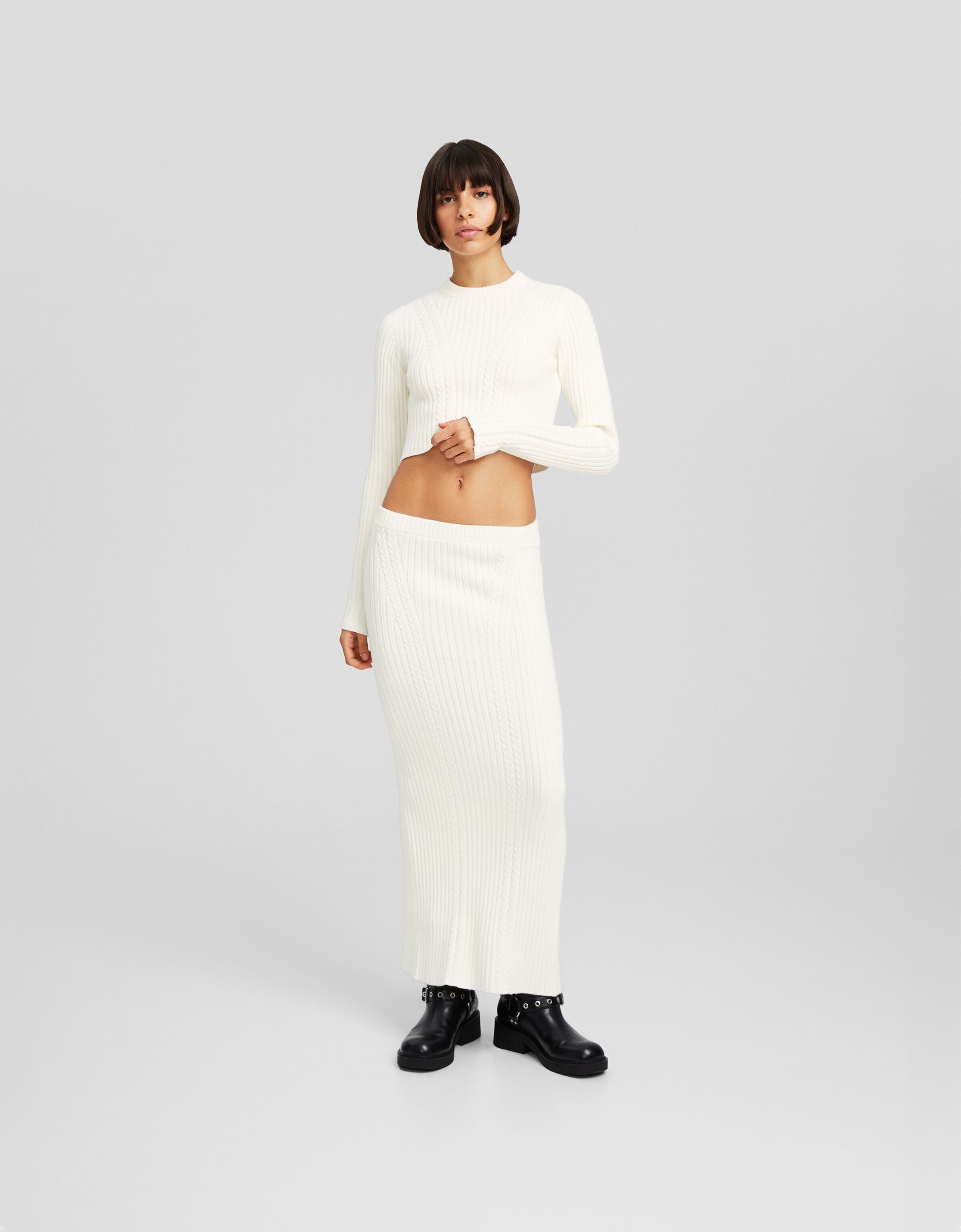 Falda midi punto trenzas