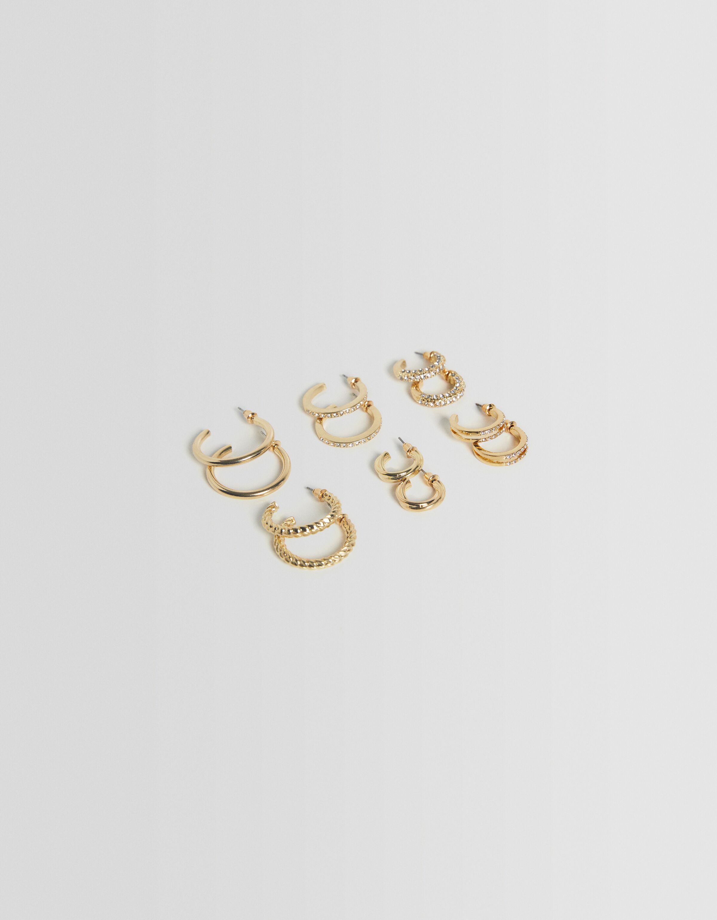 Set 6 pendientes textura pedrería