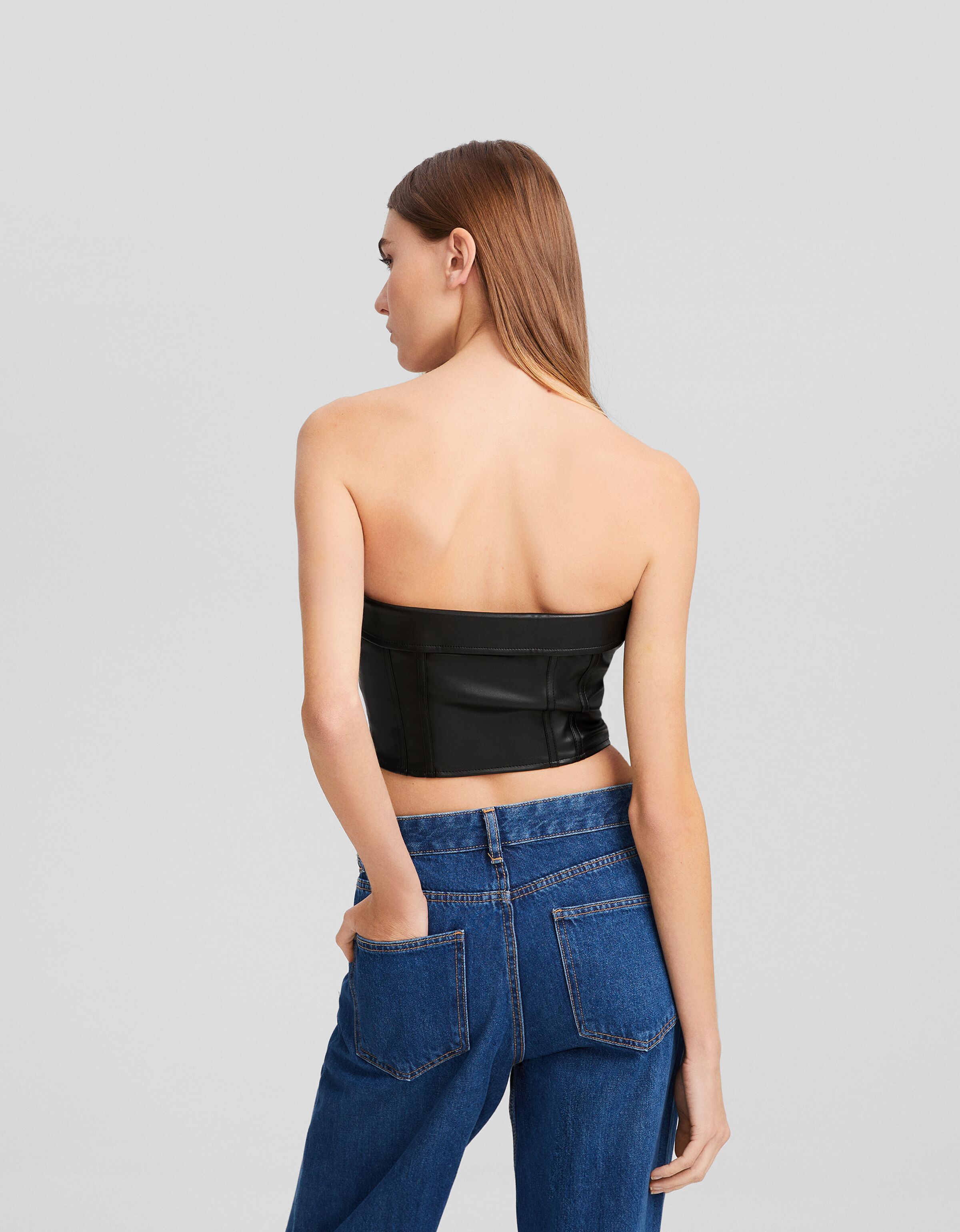 Top bustier cropped efecto piel cremalleras