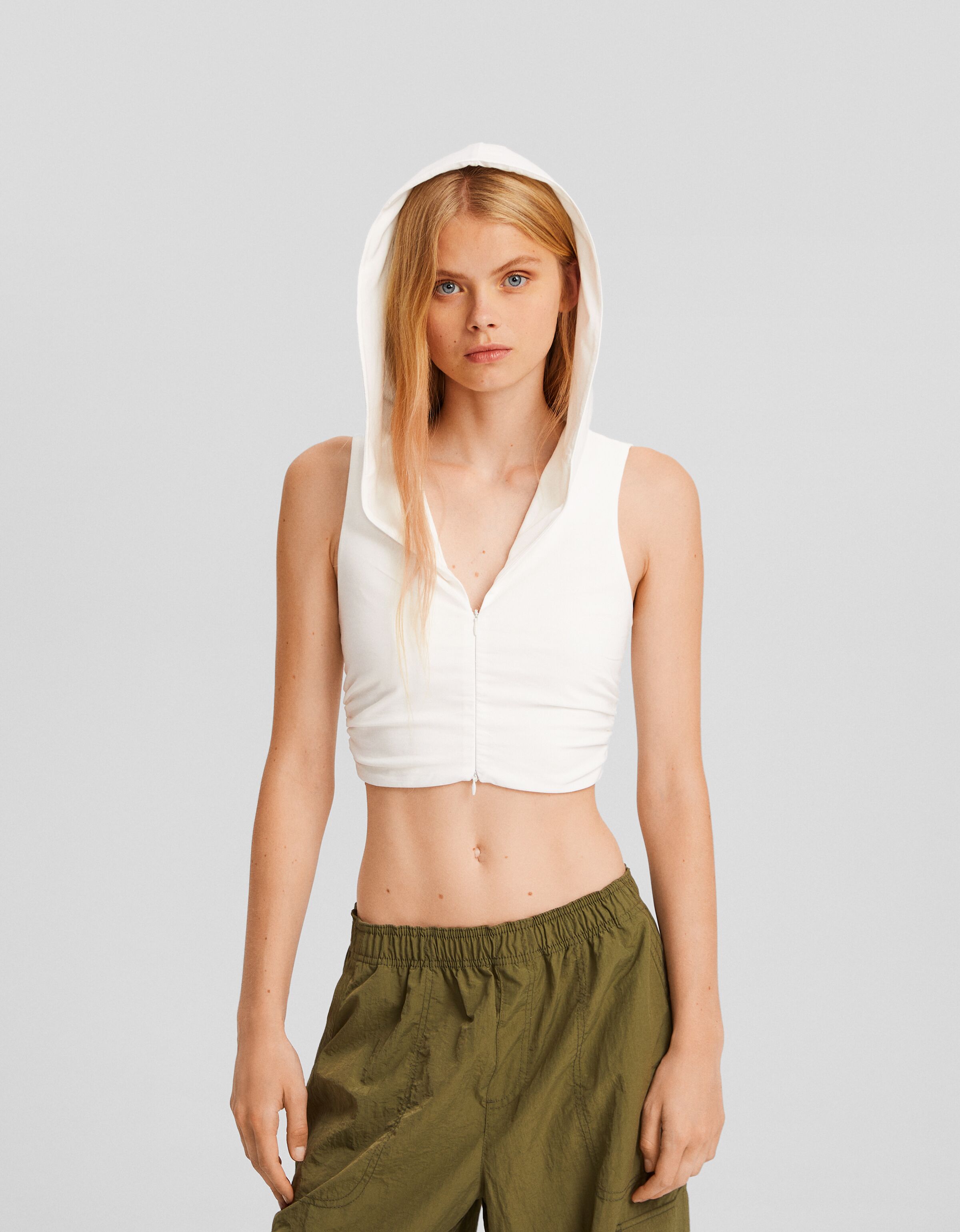 Camisa sin mangas capucha cremallera