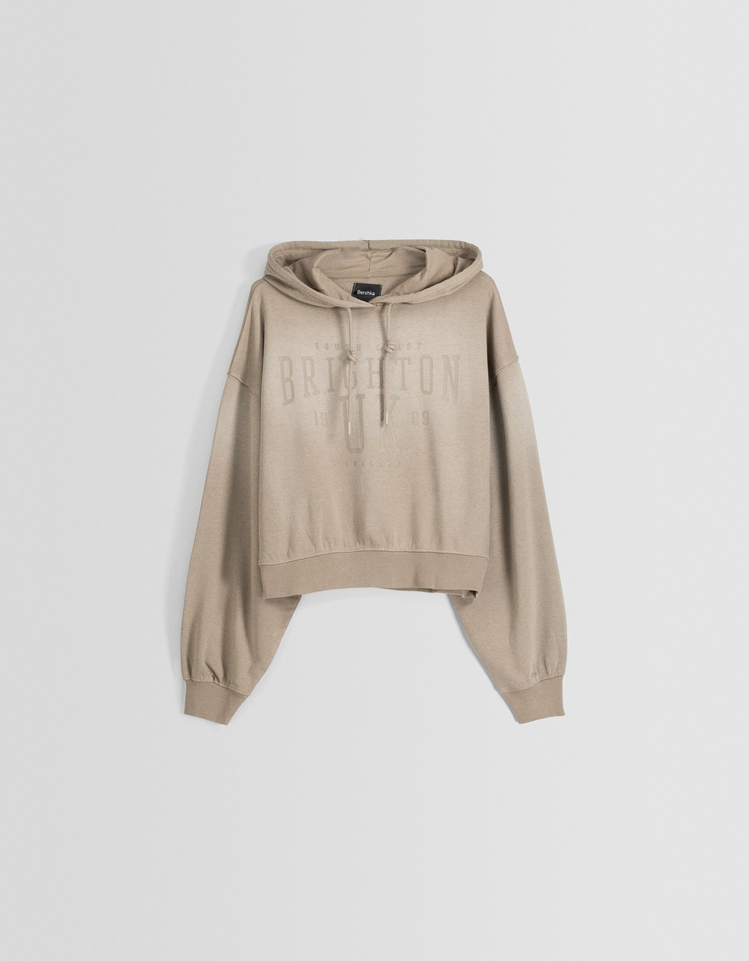 Sudadera capucha oversize efecto lavado texto