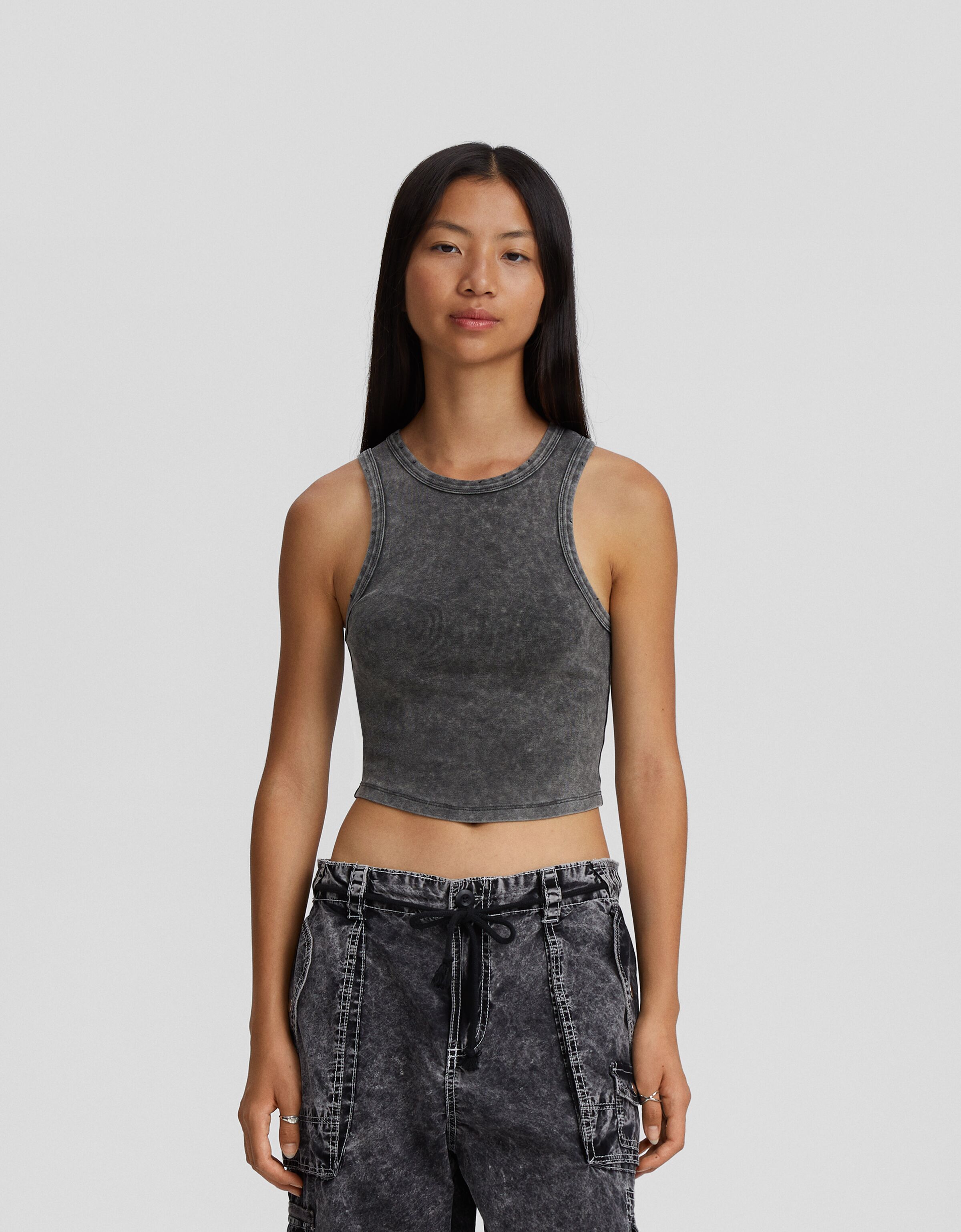 Camiseta sin mangas efecto lavado rotos