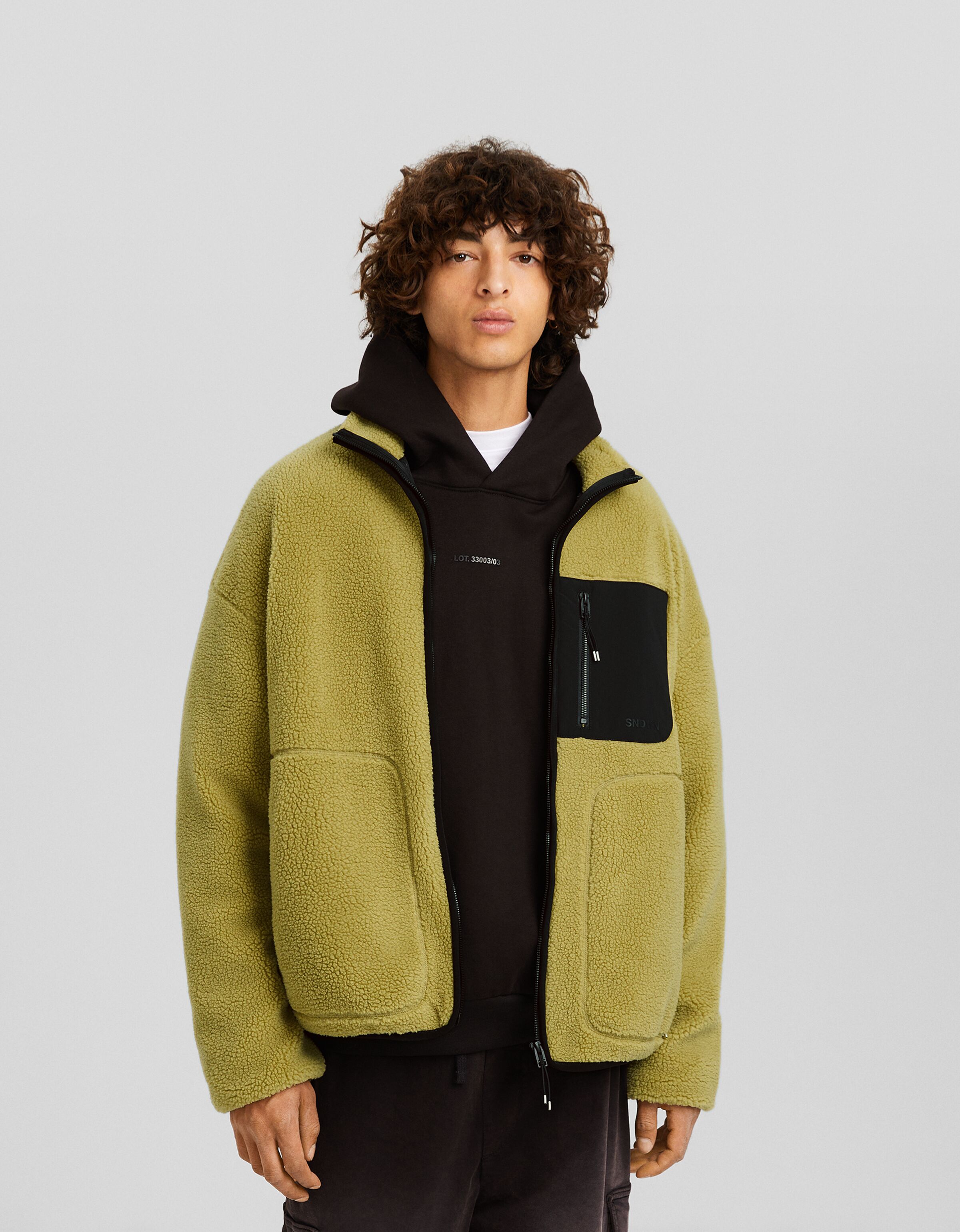 Cazadora borreguillo bolsillo técnico