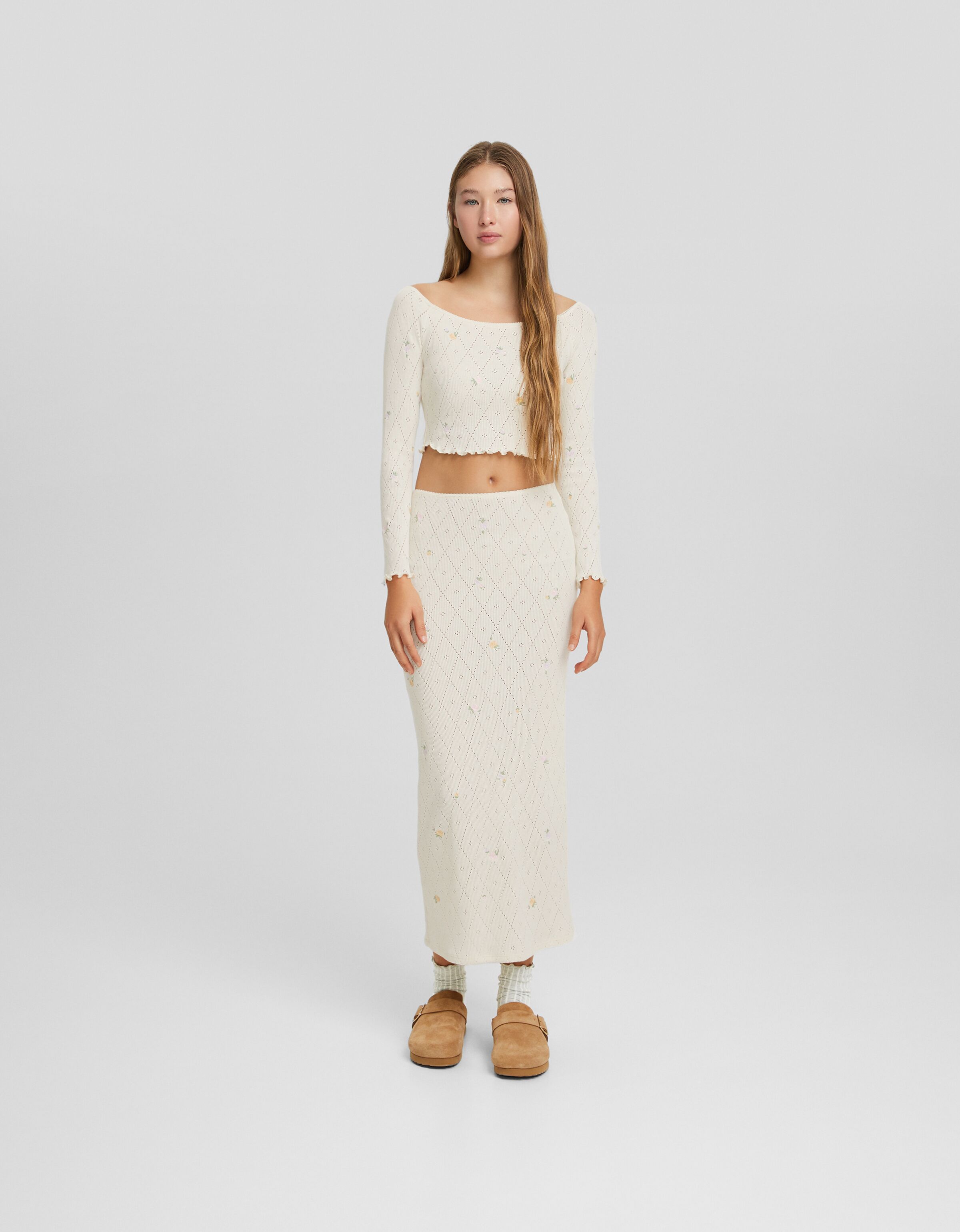 Falda midi punto pointelle bordados