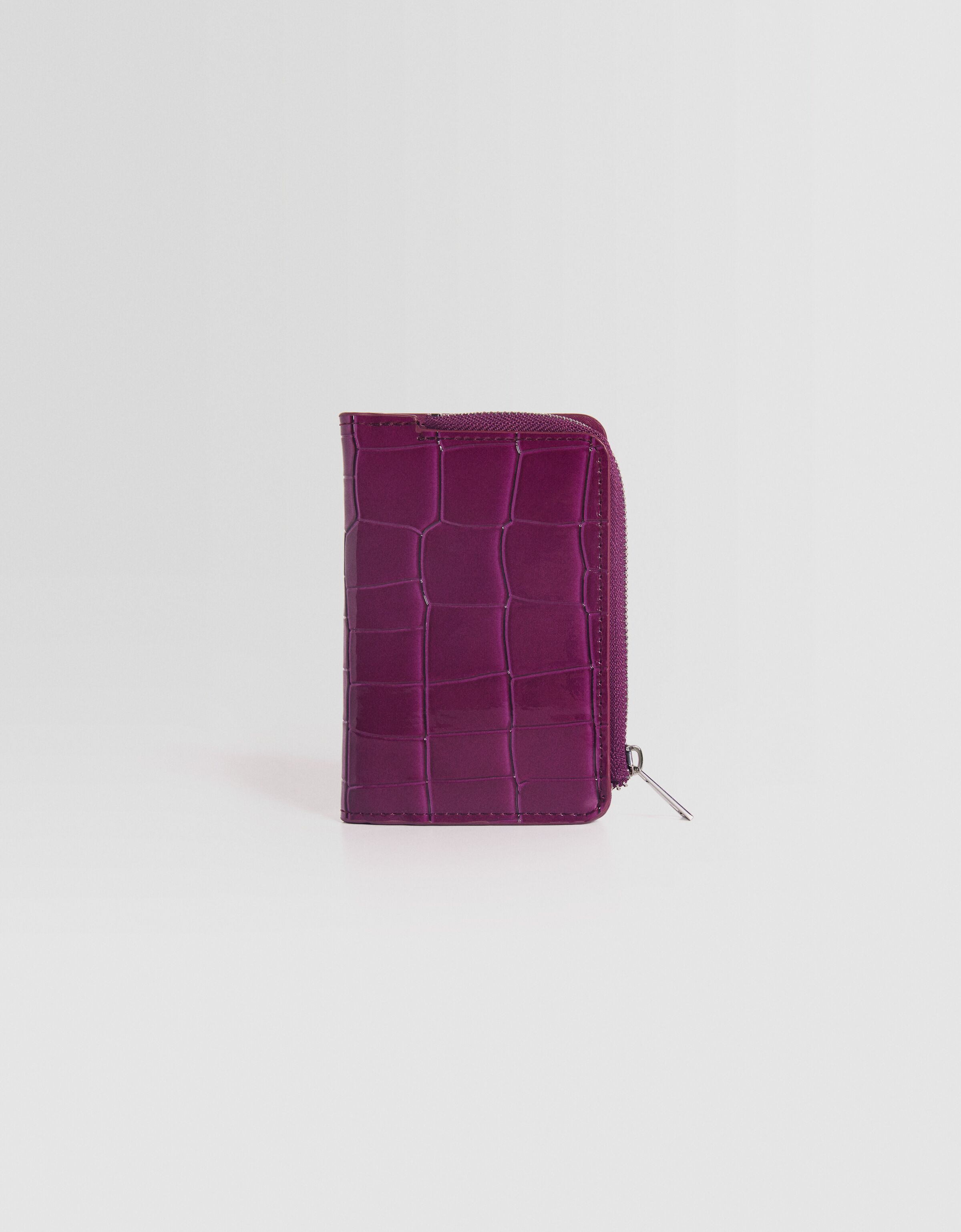 Monedero efecto charol grabado estampado animal