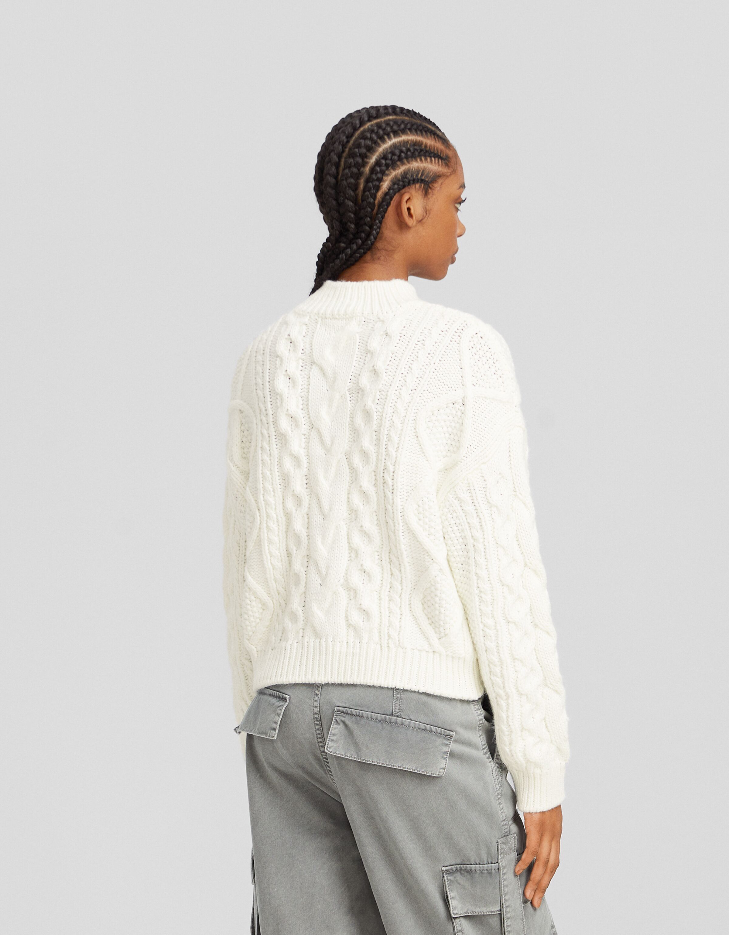 Jersey cuello subido trenzas
