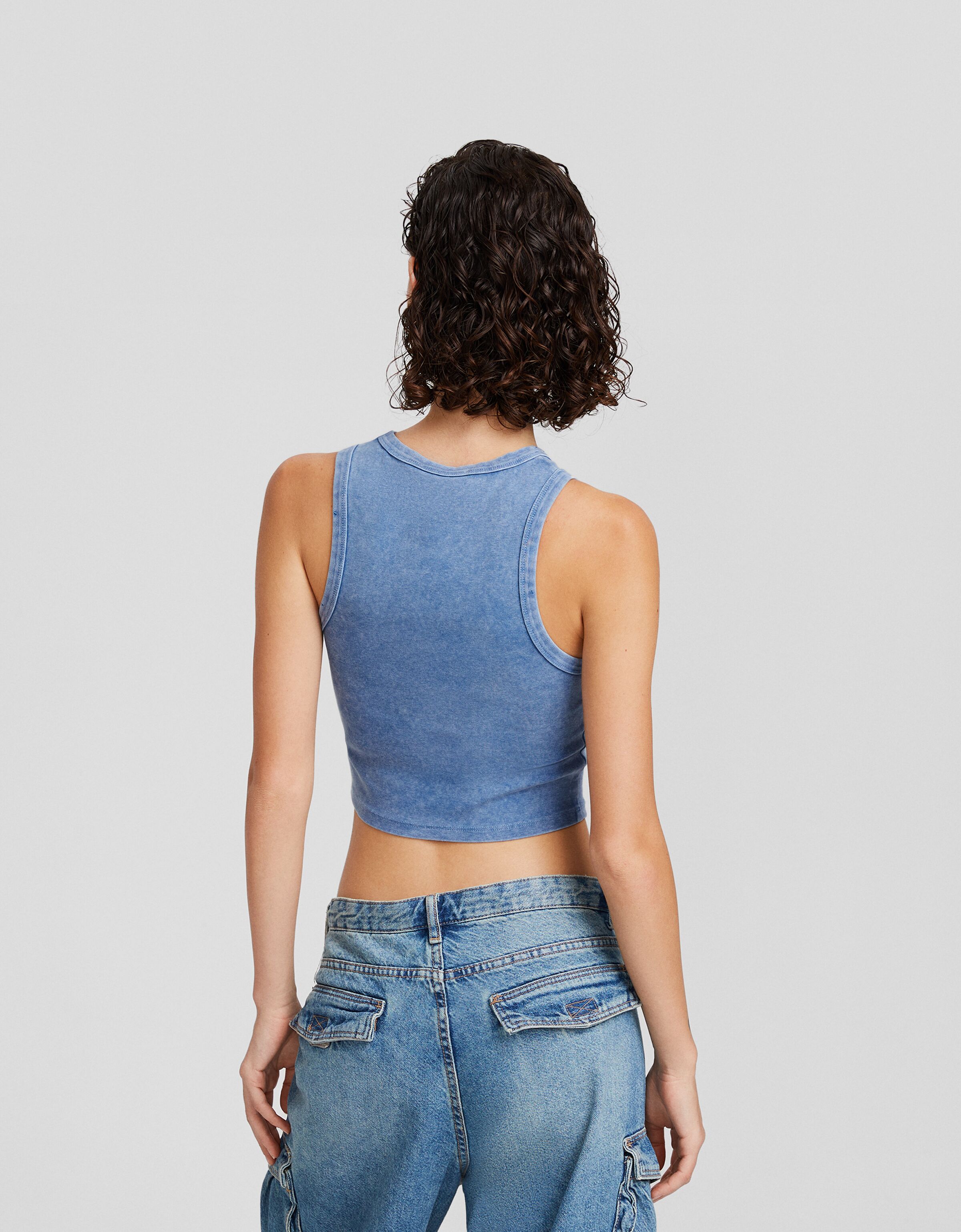 Camiseta sin mangas efecto lavado rotos