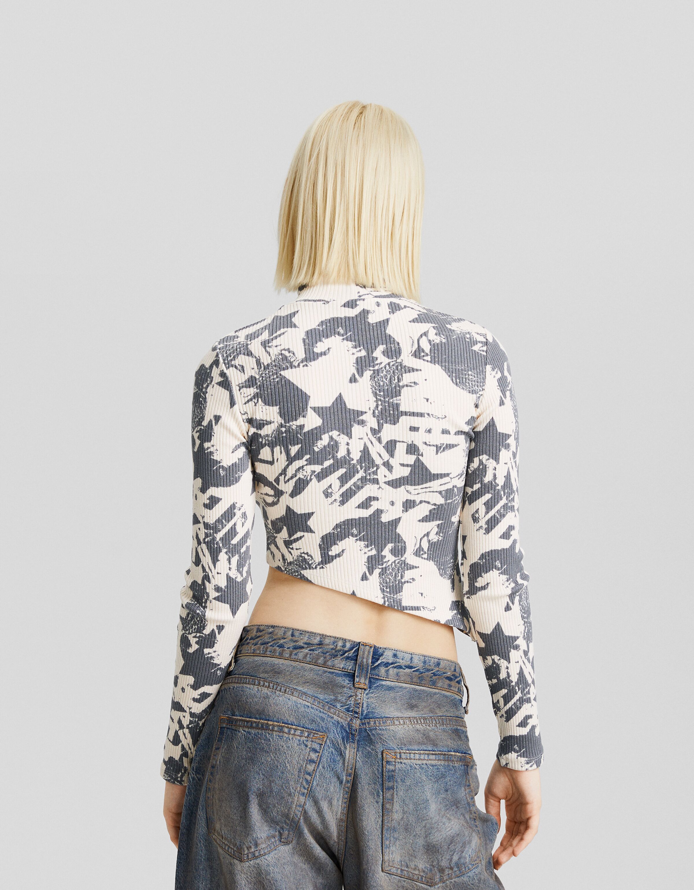 Jersey cuello subido asimétrico print