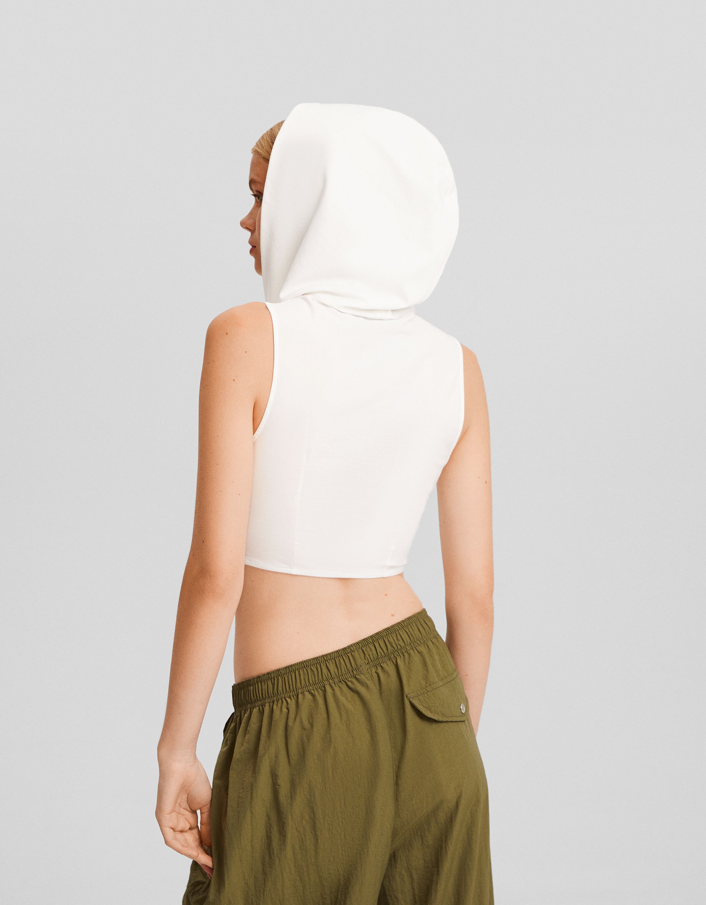 Camisa sin mangas capucha cremallera