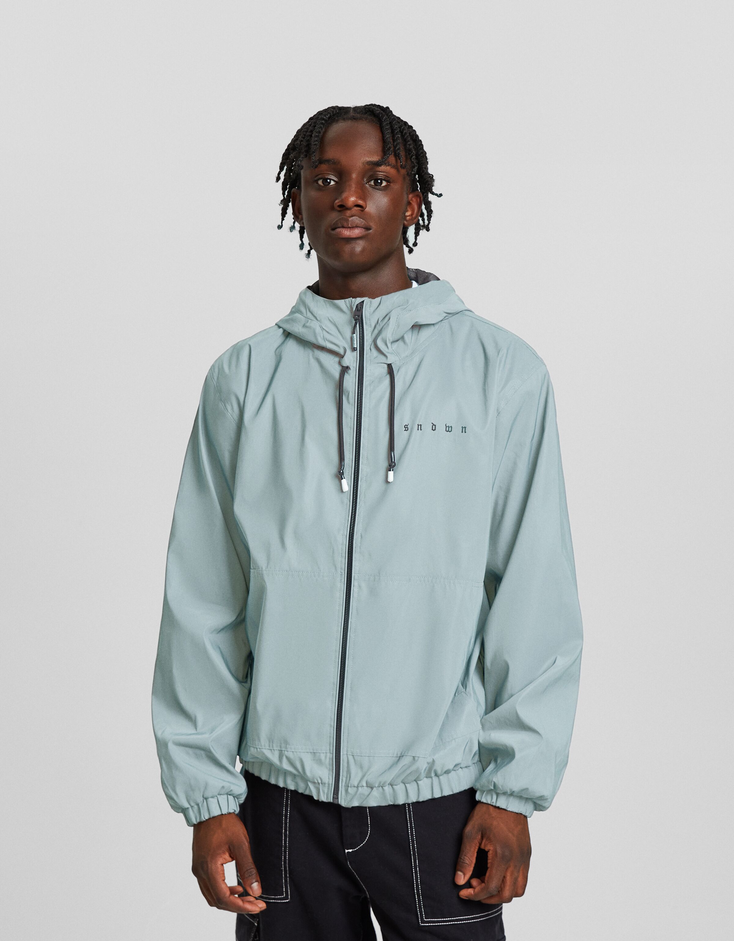 Cazadora reflectante capucha