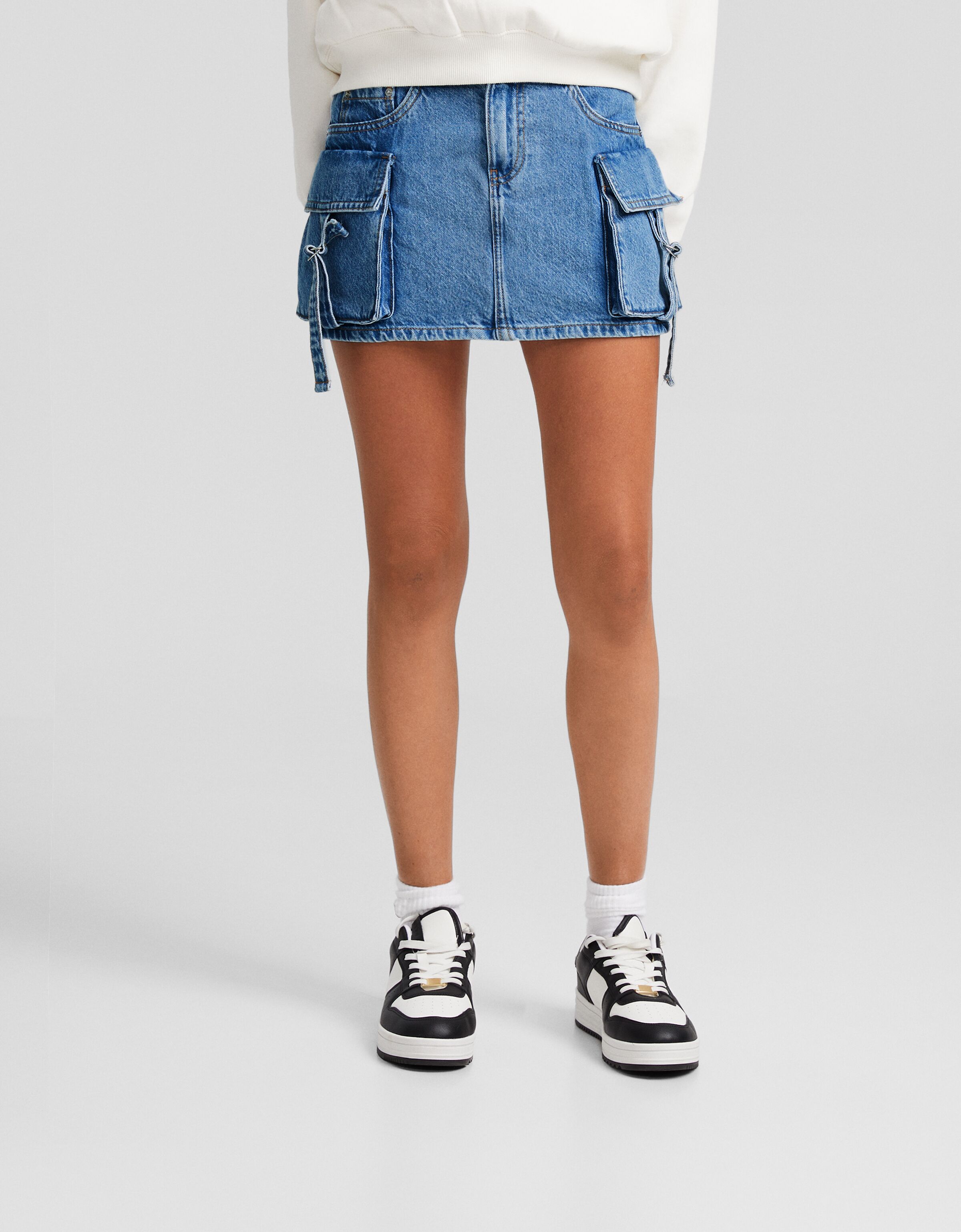 Falda denim mini cargo