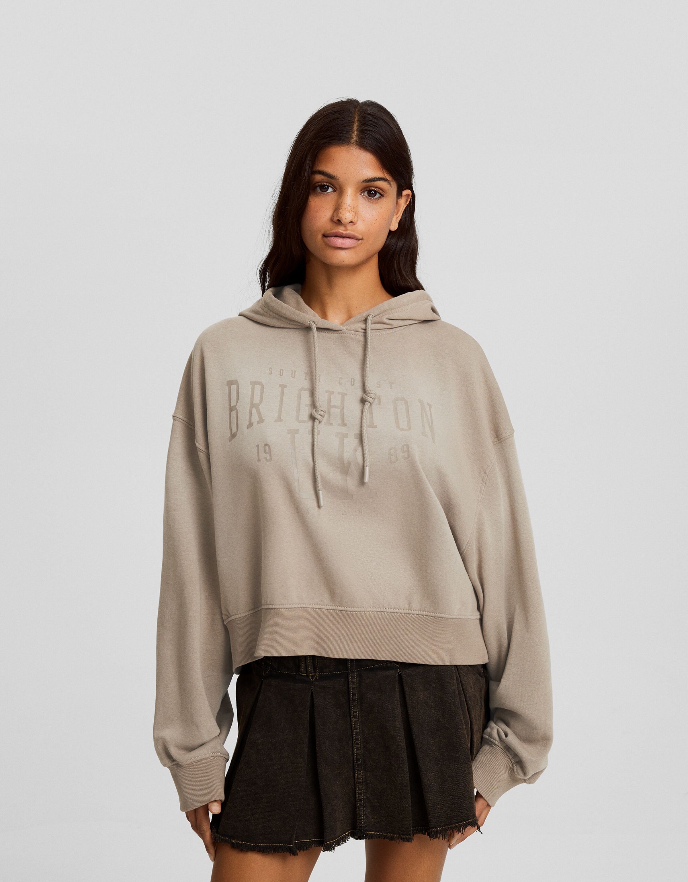 Sudadera capucha oversize efecto lavado texto