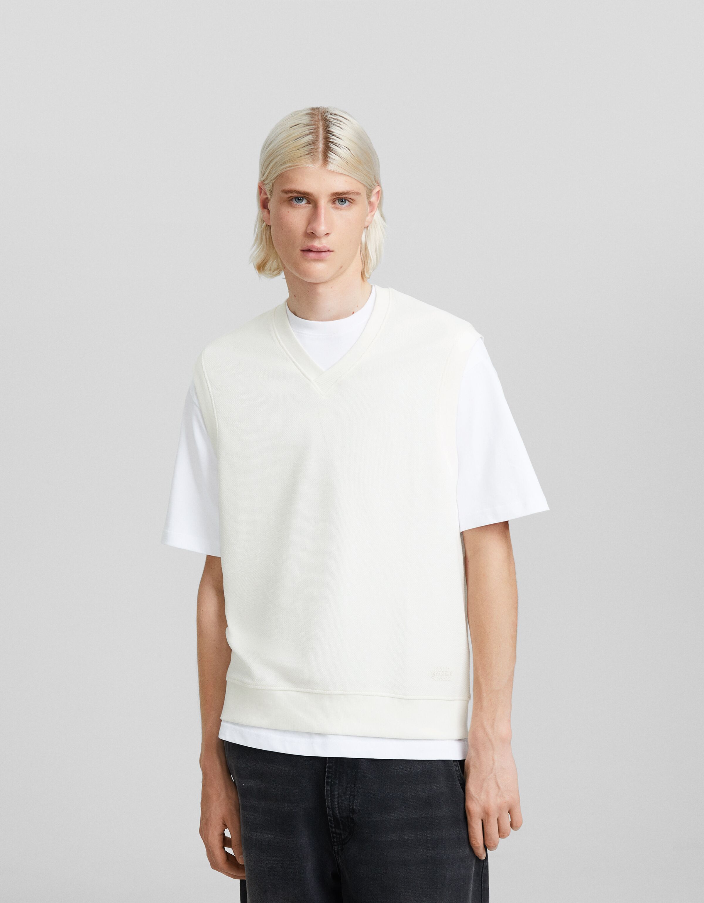 Chaleco cuello pico punto