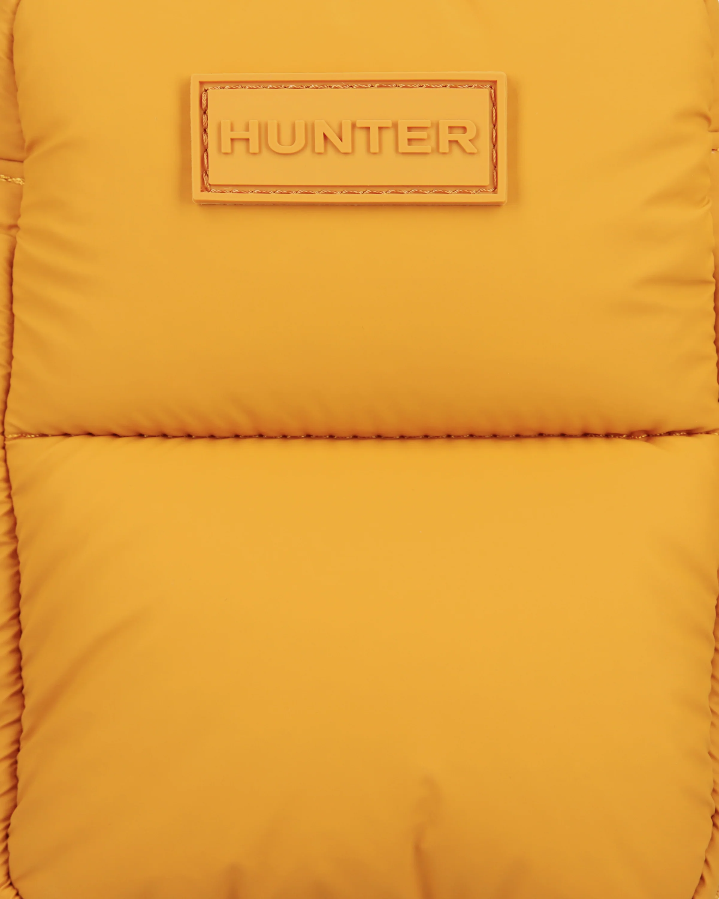 イントレピッド エクストラ パフド フォンポーチ - リッチオーカー