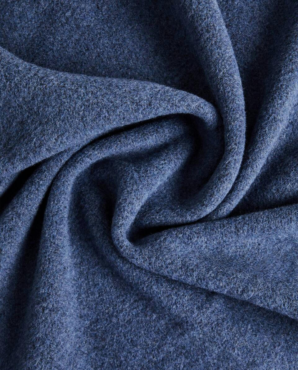 PLAIN-COLOURED BLANKET WITH FRINGE