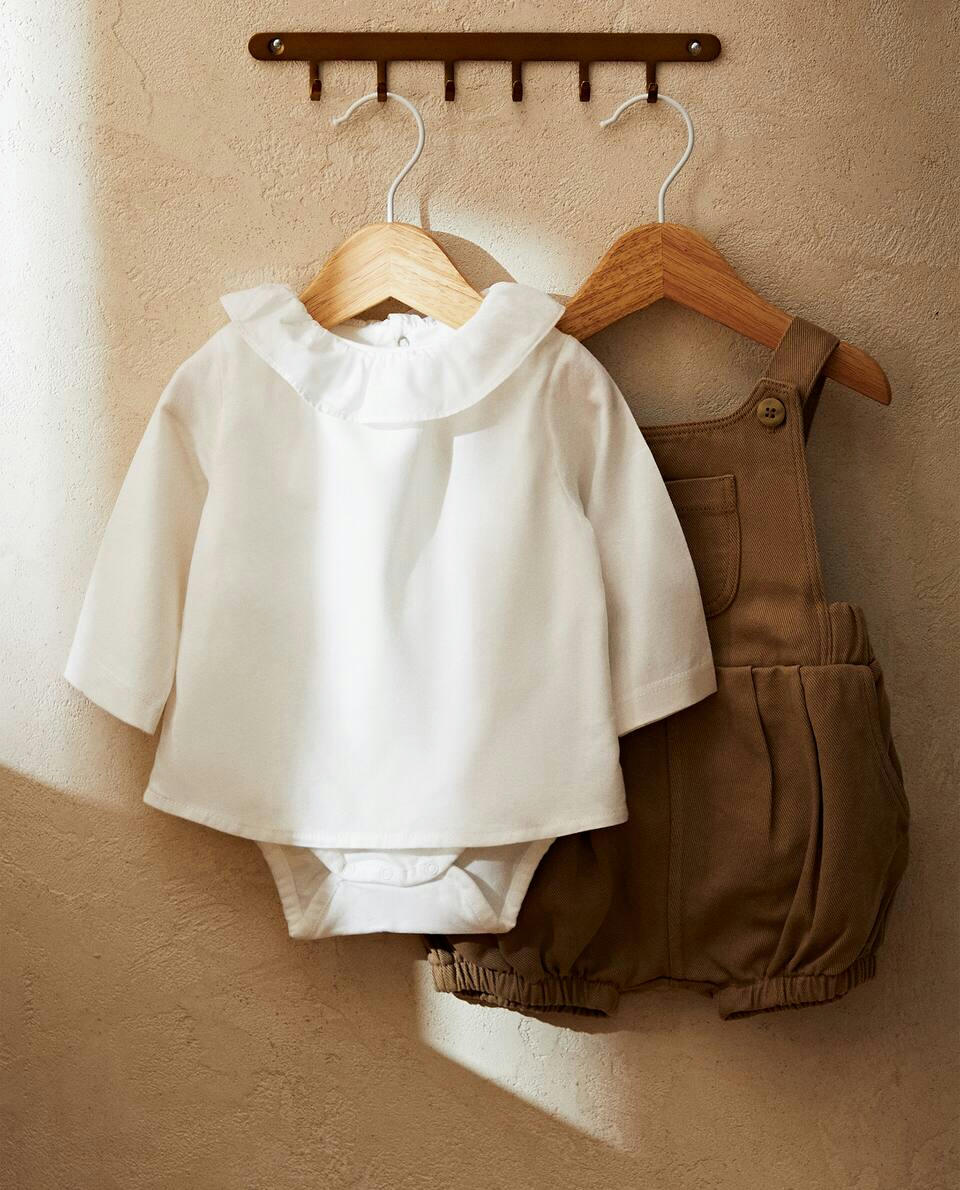 COTTON BODYSUIT WITH RUFFLED NECKLINE