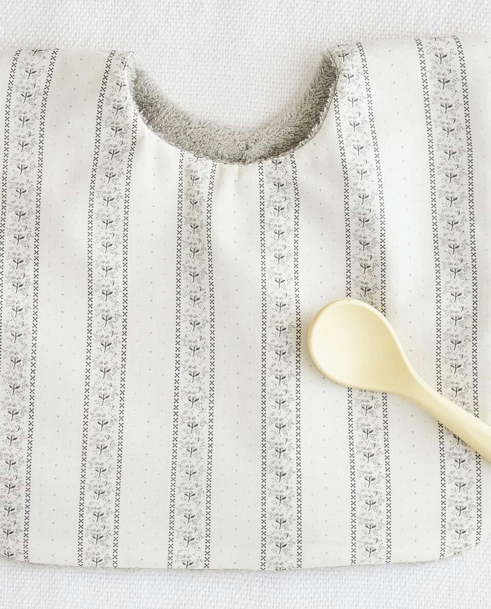 BIB WITH FLORAL BORDER