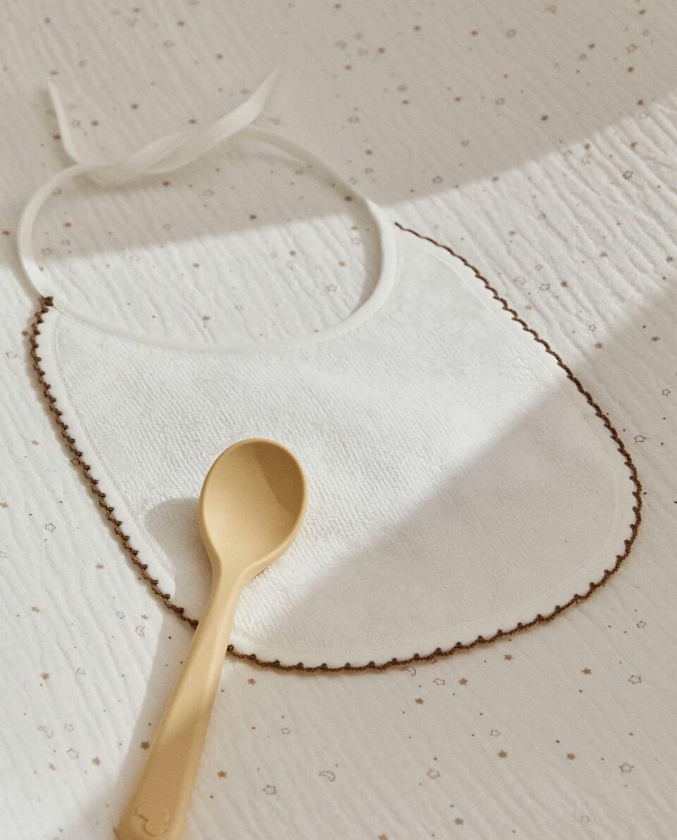 VELOUR BIB WITH TRIM DETAIL