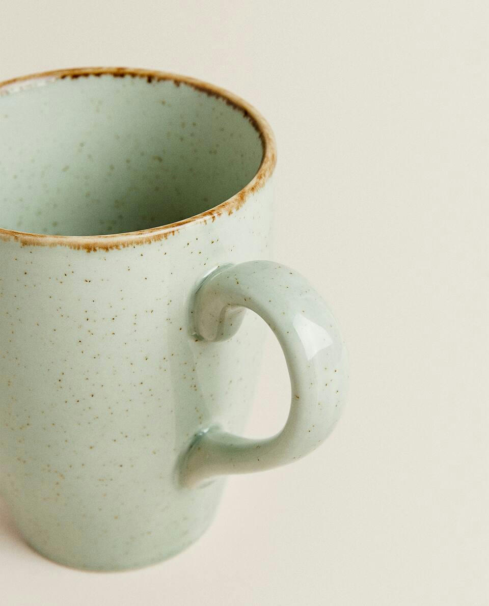 PORCELAIN MUG WITH ANTIQUE FINISH RIM