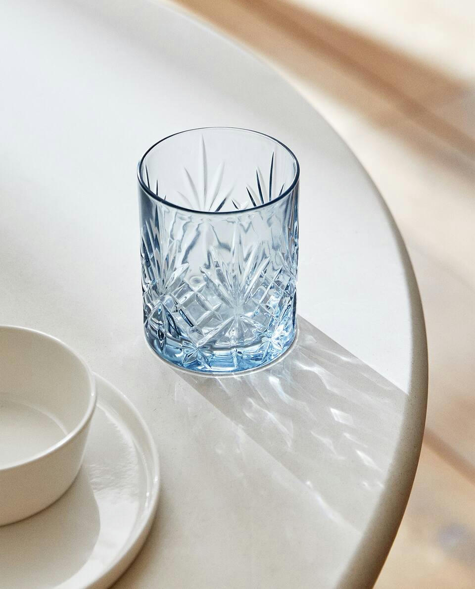 CRYSTALLINE TUMBLER WITH RAISED DESIGN