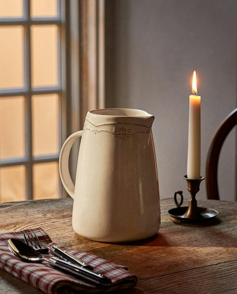 EARTHENWARE JUG WITH RAISED CHRISTMAS DESIGN