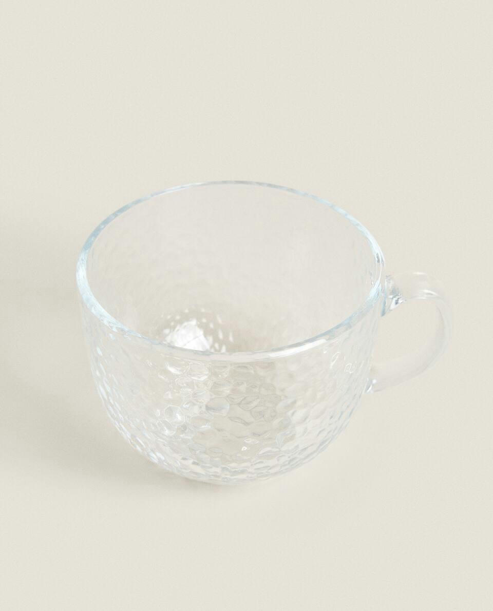 GLASS CUP WITH RAISED DESIGN