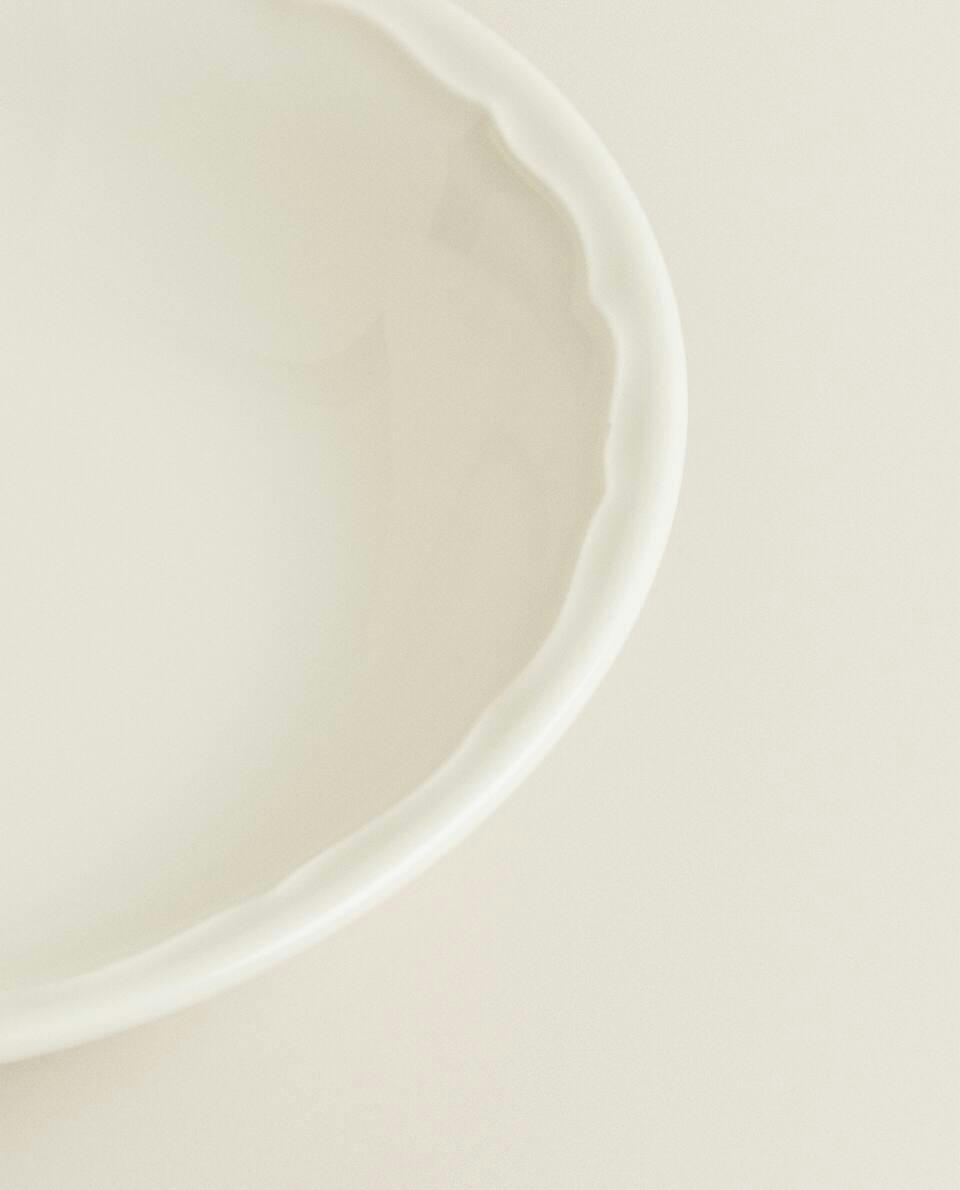 EARTHENWARE BOWL WITH RAISED-DESIGN EDGE