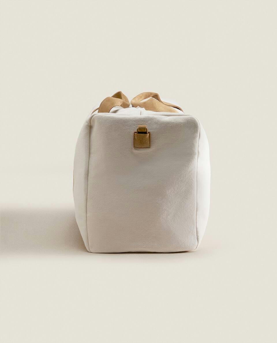 FABRIC TRAVEL BAG WITH LEATHER DETAIL
