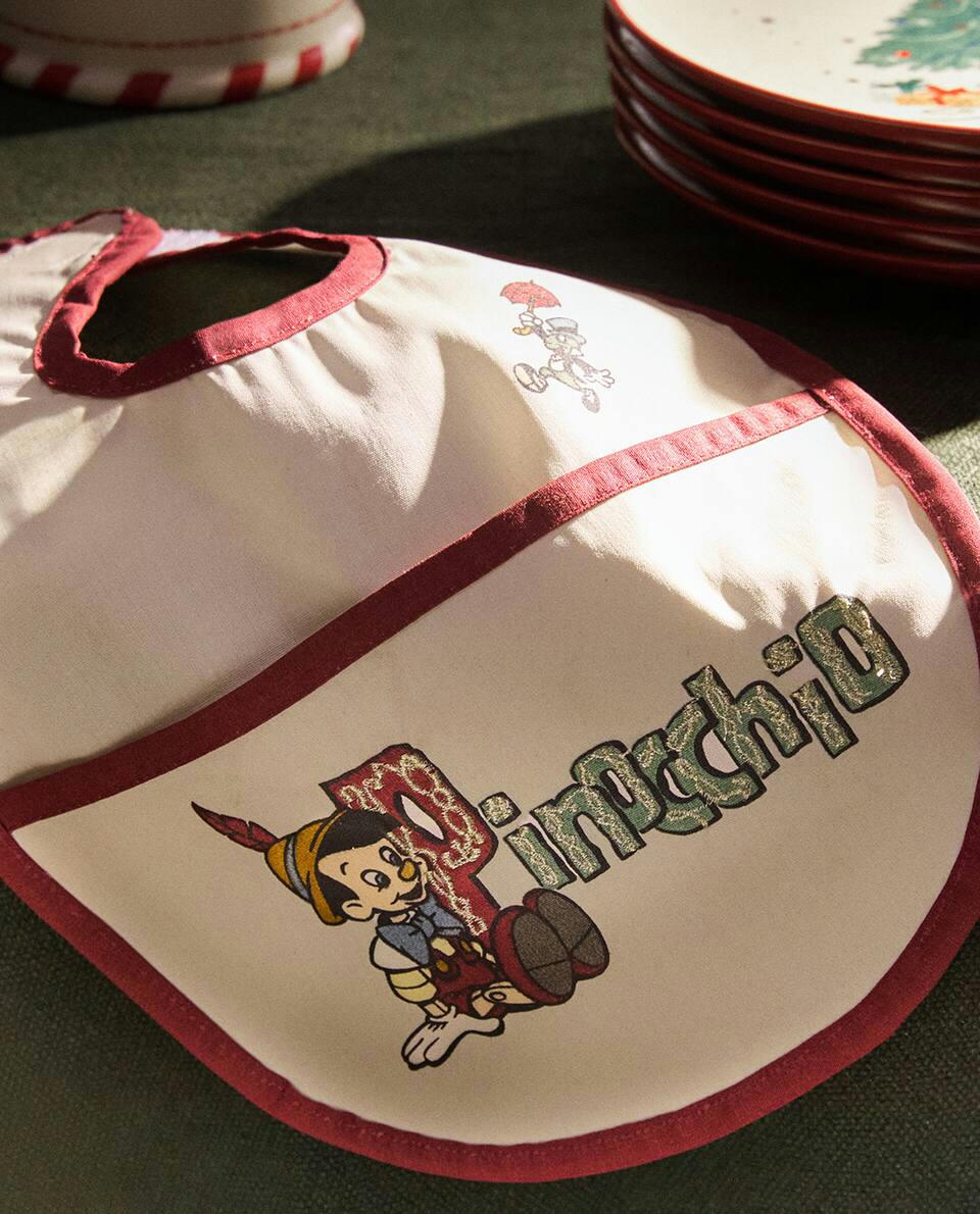 CHILDREN’S PINOCCHIO ? DISNEY RESIN-COATED CHRISTMAS BIB