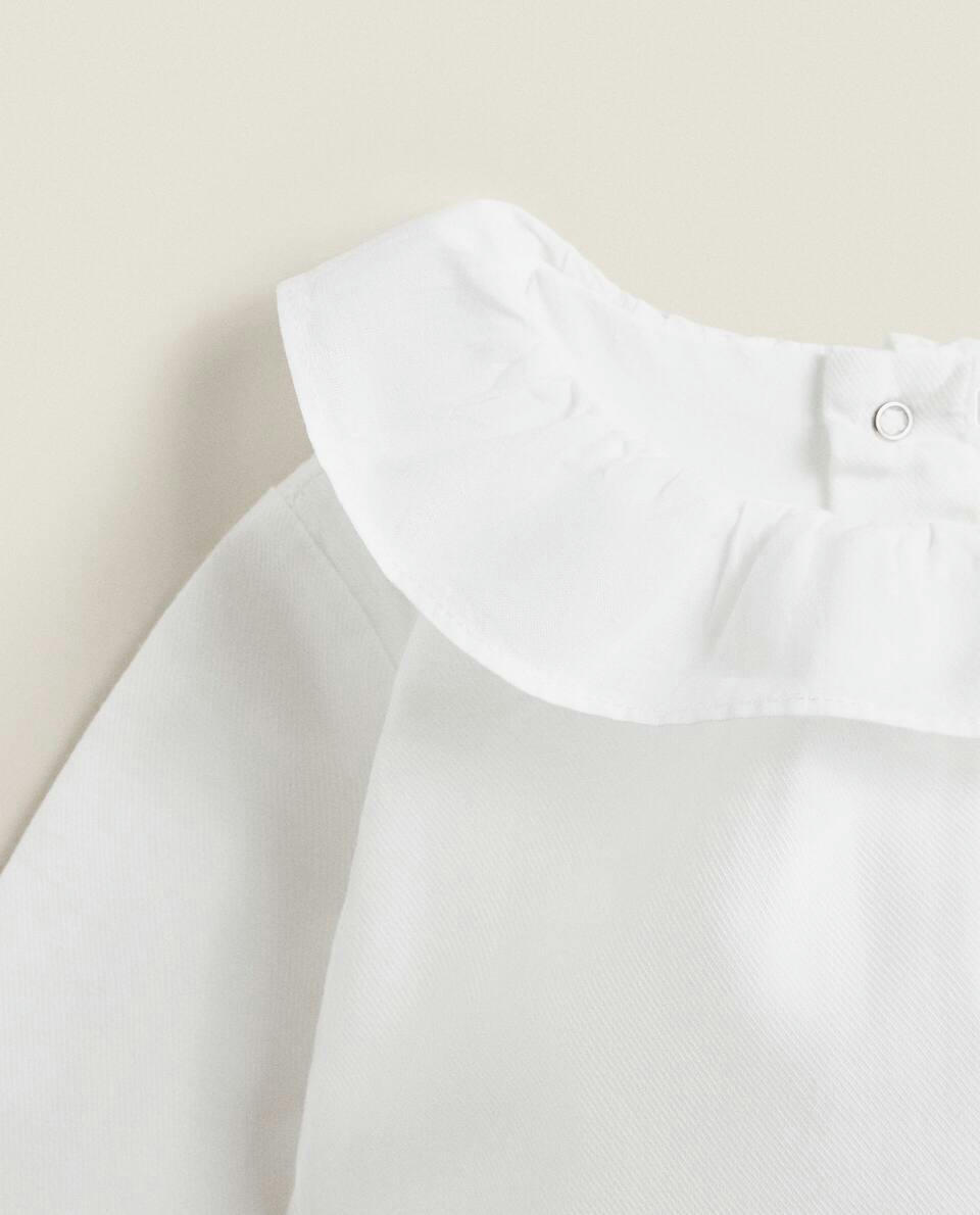 COTTON BODYSUIT WITH RUFFLED NECKLINE