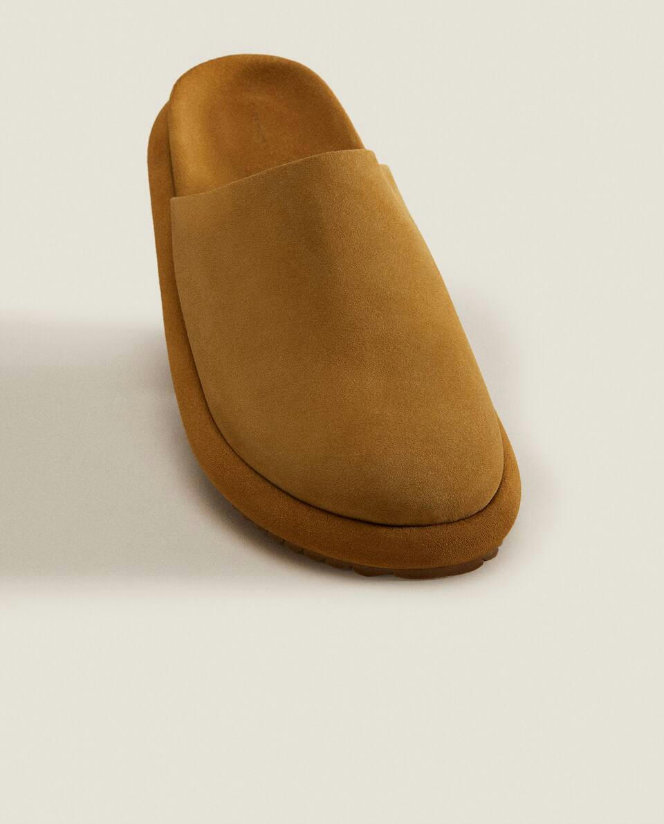 LEATHER MULE SLIPPERS WITH SOLE DETAIL
