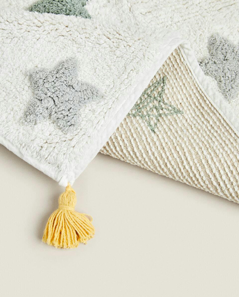 CHILDREN'S BATH MAT WITH POM-POM STARS